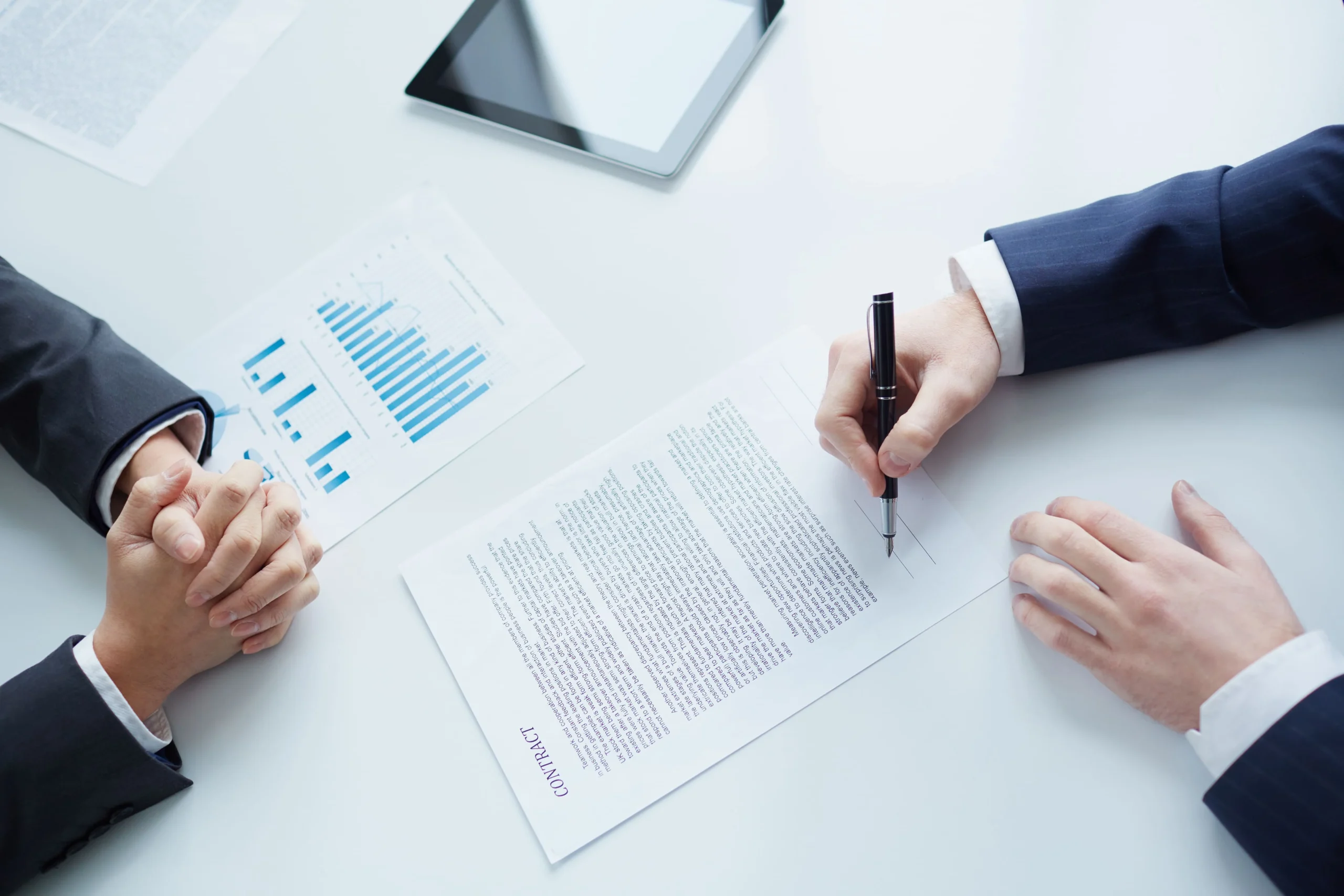 close-up-businessman-sitting-signing-contract